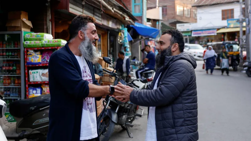 Kashmiri men greeted each other after the ceasefire announcement in Srinagar